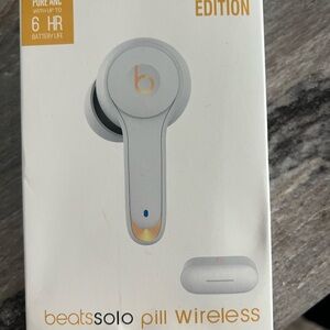 Beats by Dre White and Gold Solo Pill Wireless Earbud